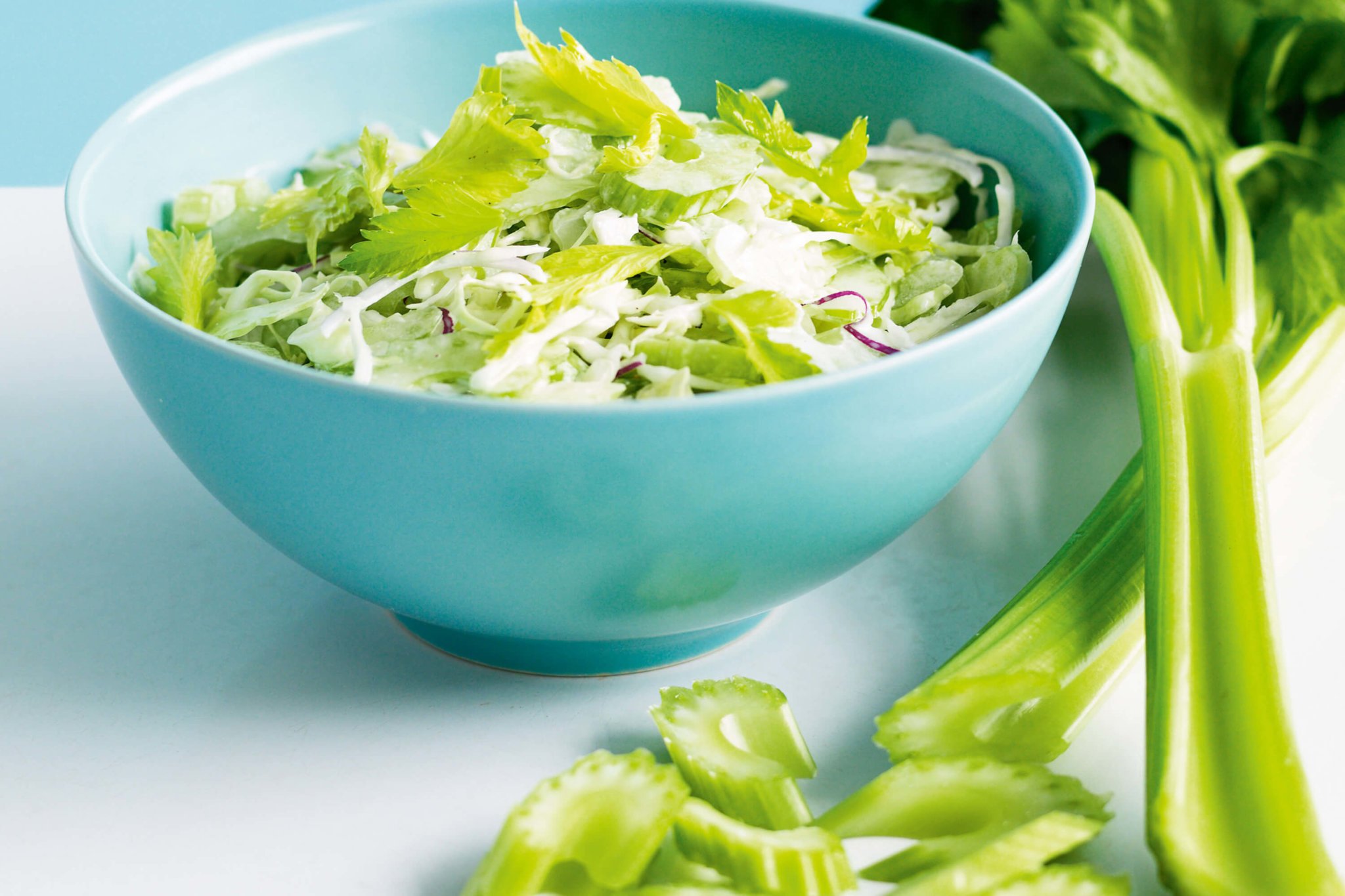 celery salad in a green bowl