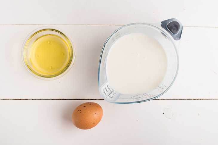 one egg, a jar of yogurt on the kitchen table